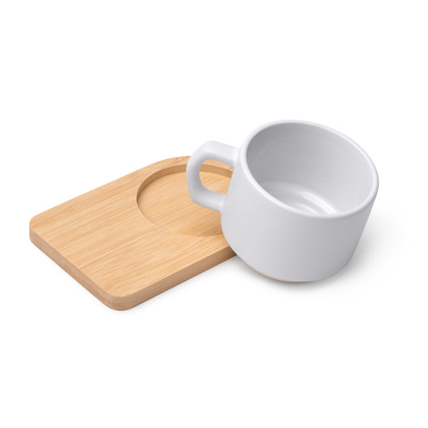 Tazza in ceramica con finitura esterna opaca, manico dal design irregolare e base in bambù. Capacità 180 ml,sublimatica